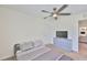 This bedroom features modern gray decor and a ceiling fan, creating a relaxing ambiance at 5438 Summer Sunset Dr, Apollo Beach, FL 33572