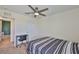 This bedroom features neutral decor and a ceiling fan, enhancing its bright and airy feel at 5438 Summer Sunset Dr, Apollo Beach, FL 33572