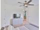 This bedroom offers neutral decor and a ceiling fan, enhancing its bright and airy feel at 5438 Summer Sunset Dr, Apollo Beach, FL 33572