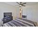This bedroom offers a sleek desk, neutral decor, and a ceiling fan, enhancing its bright and airy feel at 5438 Summer Sunset Dr, Apollo Beach, FL 33572