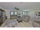 Spacious living room featuring modern furnishings, wood floors, and plenty of natural light at 5438 Summer Sunset Dr, Apollo Beach, FL 33572