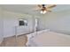 Main bedroom with natural light, a ceiling fan, and carpeted floors at 5438 Summer Sunset Dr, Apollo Beach, FL 33572
