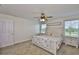 Main bedroom with natural light, a ceiling fan, and carpeted floors at 5438 Summer Sunset Dr, Apollo Beach, FL 33572