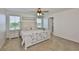 Main bedroom with natural light, a ceiling fan, and carpeted floors at 5438 Summer Sunset Dr, Apollo Beach, FL 33572