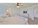Main bedroom with natural light, a ceiling fan, and carpeted floors at 5438 Summer Sunset Dr, Apollo Beach, FL 33572