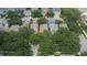 Aerial view of a single Gathering home surrounded by mature trees in a quiet residential neighborhood at 5918 Beaconpark St, Lithia, FL 33547