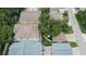 Aerial shot of houses, trees, and streets, portraying a quiet suburban setting at 5918 Beaconpark St, Lithia, FL 33547