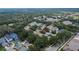 An aerial view showing the neighborhood and the property's location among lush greenery and other well-maintained homes at 5918 Beaconpark St, Lithia, FL 33547