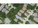 Wide aerial view of a neighborhood with various rooftops, trees, and streets at 5918 Beaconpark St, Lithia, FL 33547