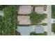 Aerial view showcases a neighborhood with well-maintained homes, trees, and green spaces at 5918 Beaconpark St, Lithia, FL 33547