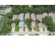 Aerial view captures a neighborhood with neatly arranged houses and green trees lining the streets at 5918 Beaconpark St, Lithia, FL 33547