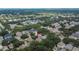 Aerial shot showing the property's position in a neighborhood dotted with mature trees and well-kept residences at 5918 Beaconpark St, Lithia, FL 33547