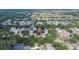 Aerial view showing the home surrounded by lush trees in a well-planned neighborhood at 5918 Beaconpark St, Lithia, FL 33547