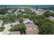Aerial shot showing the roof of the house among other homes in a neatly organized neighborhood with greenery at 5918 Beaconpark St, Lithia, FL 33547