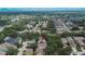Aerial view featuring the house nestled in a neighborhood with lush greenery and well-maintained residential properties at 5918 Beaconpark St, Lithia, FL 33547
