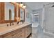Stunning bathroom boasts dual sinks, freestanding tub, subway tile and a window at 5918 Beaconpark St, Lithia, FL 33547