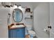 Charming half bathroom with stylish vanity, decorative mirror, and modern fixtures at 5918 Beaconpark St, Lithia, FL 33547