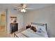 Comfortable bedroom features modern black dresser, closet and a ceiling fan at 5918 Beaconpark St, Lithia, FL 33547