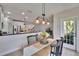 Chic dining area seamlessly connected to the kitchen and living spaces at 5918 Beaconpark St, Lithia, FL 33547