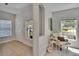 Inviting entryway featuring tile floors, natural light, and a comfortable sitting area at 5918 Beaconpark St, Lithia, FL 33547