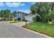 View of the neighborhood street featuring manicured lawns and attractive home exteriors at 5918 Beaconpark St, Lithia, FL 33547