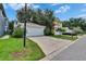 Exterior of home featuring a one-car garage with driveway and landscaping at 5918 Beaconpark St, Lithia, FL 33547