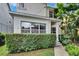 Charming home exterior with a neat hedge, lush greenery, and bright windows allowing plenty of natural light at 5918 Beaconpark St, Lithia, FL 33547