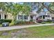 Charming home with blue shutters and lush landscaping at 5918 Beaconpark St, Lithia, FL 33547