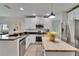 Bright kitchen with white cabinetry, stainless steel appliances, and a butcher block island at 5918 Beaconpark St, Lithia, FL 33547