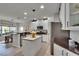 Well-lit kitchen with a butcher block island, stainless steel appliances, and a breakfast nook at 5918 Beaconpark St, Lithia, FL 33547