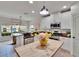Spacious kitchen featuring white cabinets, stainless steel appliances, and butcher block island at 5918 Beaconpark St, Lithia, FL 33547