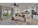 Bright living room open to the kitchen featuring stylish decor and large windows at 5918 Beaconpark St, Lithia, FL 33547