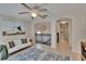 Bright loft space with neutral colors, modern art, and view of the staircase at 5918 Beaconpark St, Lithia, FL 33547