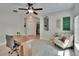 Bright office space with modern furnishings, a ceiling fan, and natural light at 5918 Beaconpark St, Lithia, FL 33547