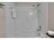 A bright white tiled shower and tub combination at 5918 Beaconpark St, Lithia, FL 33547