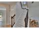 Elegant staircase with a dark railing and white risers and treads at 5918 Beaconpark St, Lithia, FL 33547