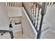 Staircase with dark railing and white stairs at 5918 Beaconpark St, Lithia, FL 33547