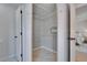 Bright walk-in closet with built-in shelving and hanging rods at 5918 Beaconpark St, Lithia, FL 33547