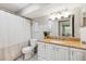 This bathroom features a shower with curtain, toilet and cabinet at 602 Timber Bay W Cir, Oldsmar, FL 34677
