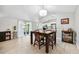 Open concept dining room adjacent to the kitchen, with modern light fixture and natural light at 602 Timber Bay W Cir, Oldsmar, FL 34677