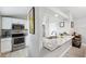 Modern kitchen with granite countertops, stainless steel appliances and white cabinets at 602 Timber Bay W Cir, Oldsmar, FL 34677