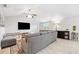 Comfortable living room featuring modern decor, neutral colors, and a ceiling fan at 602 Timber Bay W Cir, Oldsmar, FL 34677