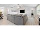 Spacious living room with vaulted ceiling, neutral tones and views to adjacent rooms at 602 Timber Bay W Cir, Oldsmar, FL 34677
