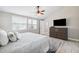 This main bedroom features a ceiling fan, window and drawers at 602 Timber Bay W Cir, Oldsmar, FL 34677