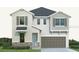 Charming two-story home with a neutral color scheme, gray shutters, and an attached two-car garage at 6226 29Th N St, St Petersburg, FL 33702