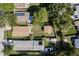 Birds-eye view of neighborhood homes showcasing landscaping, driveways, and some with solar panels on roofs at 6658 Stewart N Ave, St Petersburg, FL 33702