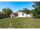 Well-maintained backyard with an outdoor grill and a covered patio at 6658 Stewart N Ave, St Petersburg, FL 33702