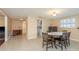 Charming dining area featuring tile floors, neutral colors, and seamless transition to other rooms at 6658 Stewart N Ave, St Petersburg, FL 33702