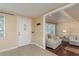 Bright foyer featuring tile flooring that leads to a spacious living area with hardwood floors at 6658 Stewart N Ave, St Petersburg, FL 33702