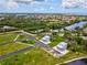 Aerial view showcases waterfront homes and available land in a picturesque community at 6679 Wander Ln, New Port Richey, FL 34652